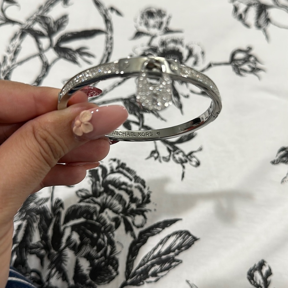 Silver tone Michael Kors bracelet-lock design